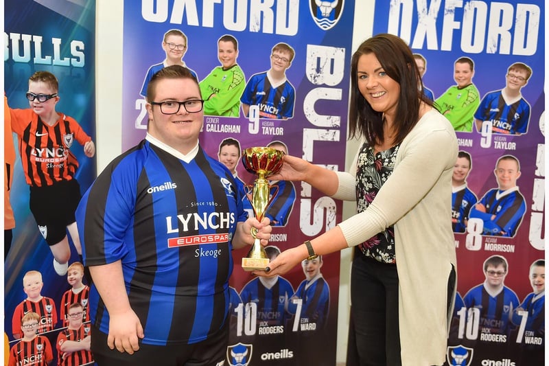 Tiernan Sweeney gets the Players Player of the Year award from Denise of Lynch’s Eurospar Skeoge.