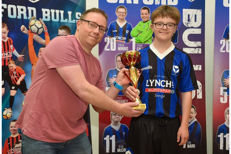 James of Lynch’s Eurospar Trench Road presents Keigan Taylor with the top goalscorer award.