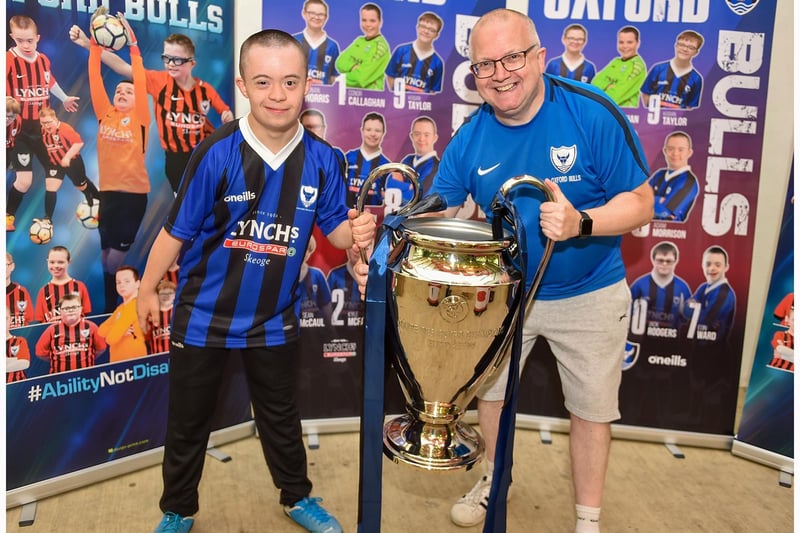 Oxford Bulls manager Kevin Morrison pictured with his son Adam and the Champions League trophy at the awards night.