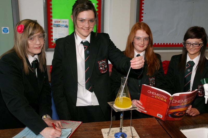 Rachel Thompson, Catherine McKendry, Megan Magill and Kirby Percy performing a science experiement at Cambridge House. INBT04-205AC
