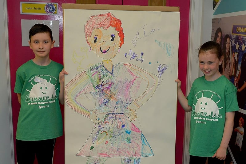 Logan and Zara, from Blue Group, pictured with art work they helped create, at the Studio 2 Annie themed Summer Scheme pictured earlier this week. DER2127GS - 010