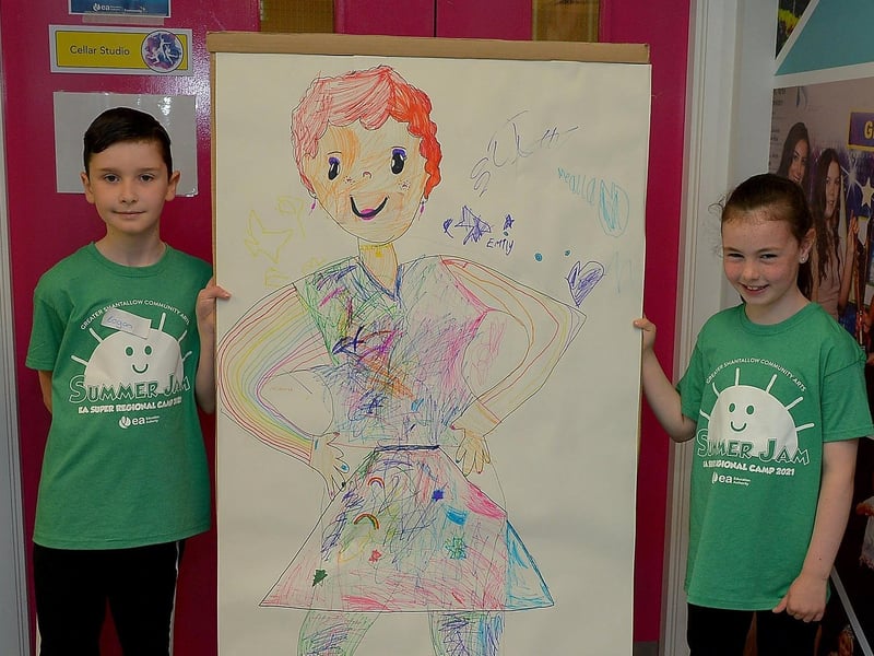Logan and Zara, from Blue Group, pictured with art work they helped create, at the Studio 2 Annie themed Summer Scheme pictured earlier this week. DER2127GS - 010