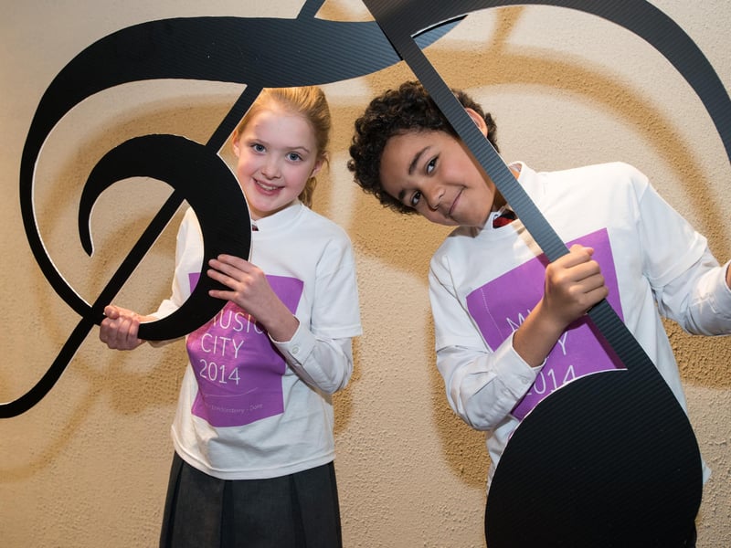 Rebekah Lawther (10) and Tyreece Smith (9) from Lisnagelvin Primary School find Derry City Council's City of Culture Legacy plan hits the right note at the launch event in the Guildhall Derry~Londonderry on thursday. Picture Martin McKeown. Inpresspics.com. 19.12.13