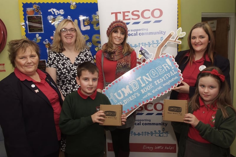 Pictured at the presentation of Junior Writer's Packs to P5 puplis at Eglinton Primary School as part of the Humdinger Children's Book Festival were, from left, Irene Hewitt, Tesco Community Champion, Sarah Hughes, Sponsorship Manager, Culture Company, Josh Lewers, Trisha Deery, Dog Ears publishers, Audrey Kincaid, Tesco Community Champion, and Ella McKnight. INLS4313-154KM