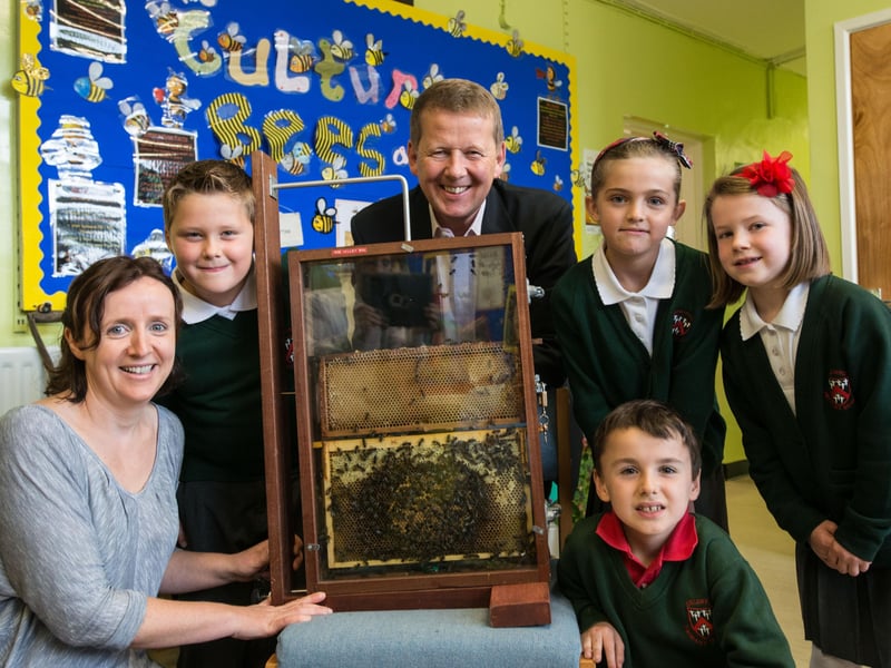 BBC Breakfast host and beekeeper, Bill Turnbull pictured with Annie Mullan from Derry City Council and Eglinton Primary School pupils, James Benbow, Charli Burnside, Sophie Wilson and Andrew Haddock during a visit to the school. Picture Martin McKeown. Inpresspics.com. 27.09.13