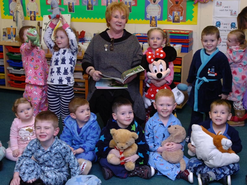 Children enjoy a bedtime story read by Anita Robinson at St Brigid's Primary School during the Big Bedtime Read event. (DER4713PG033)