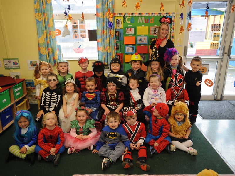 Nuala nic bhloscaidh, teacher, at the Bunscoil pictured with the children at their annual hallowe'en party. DER4413SL102