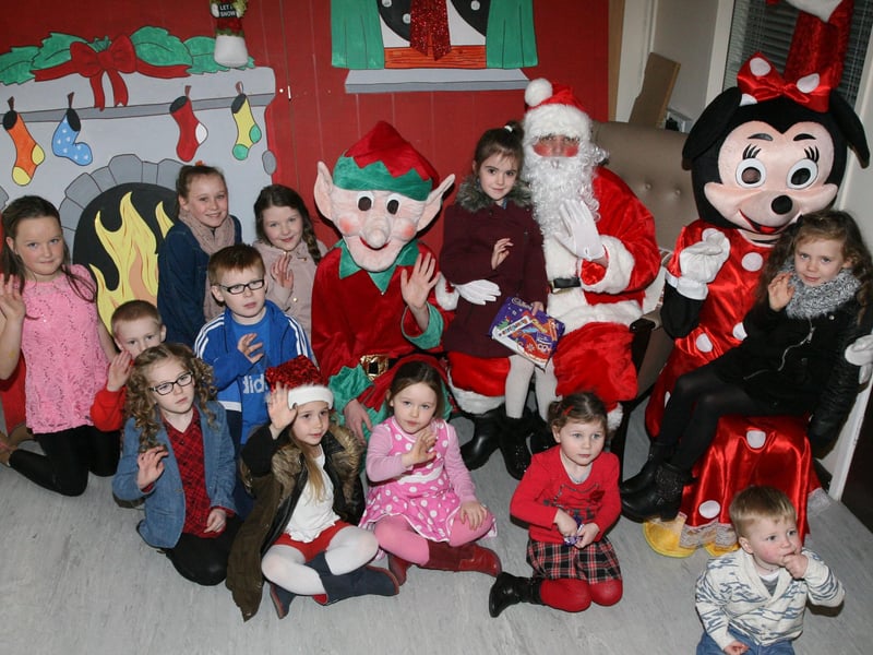 Local children pictured with Santa at the Gaelscoil Eadain Mhoir, Brandywell, Annual Christmas Fair on Sunday. Included are Santa's helpers Mr. Elf and Minnie Mouse. DER4913JM020
