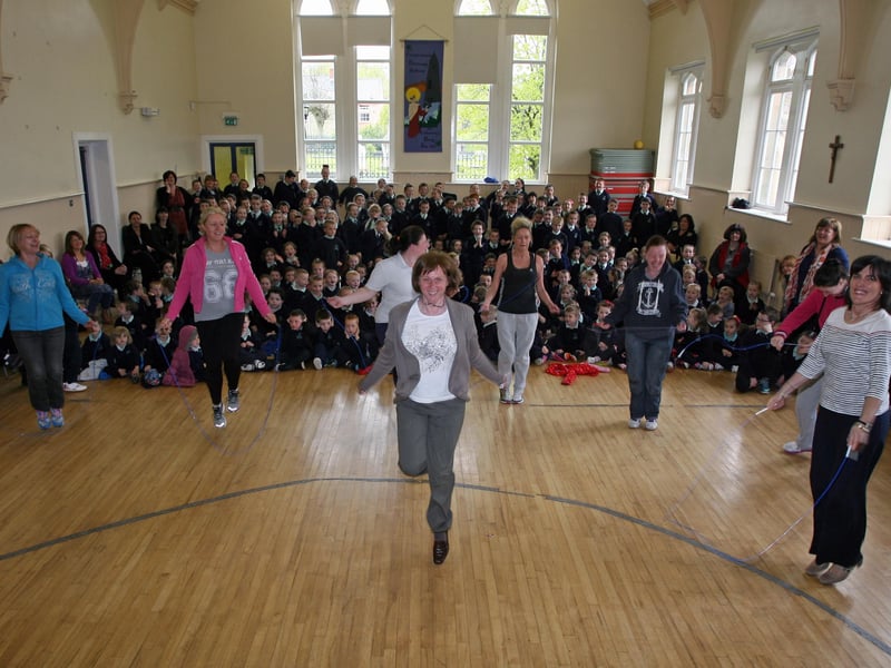 Long Tower PS Vice Principal Mrs. Josephine Brown shows the rest how it's done during the School's annual Skipathon on Friday morning. She was accompanied on the sponsored skip by parents, and on right, Mrs. Joyce Logue, Principal. 1105JM02