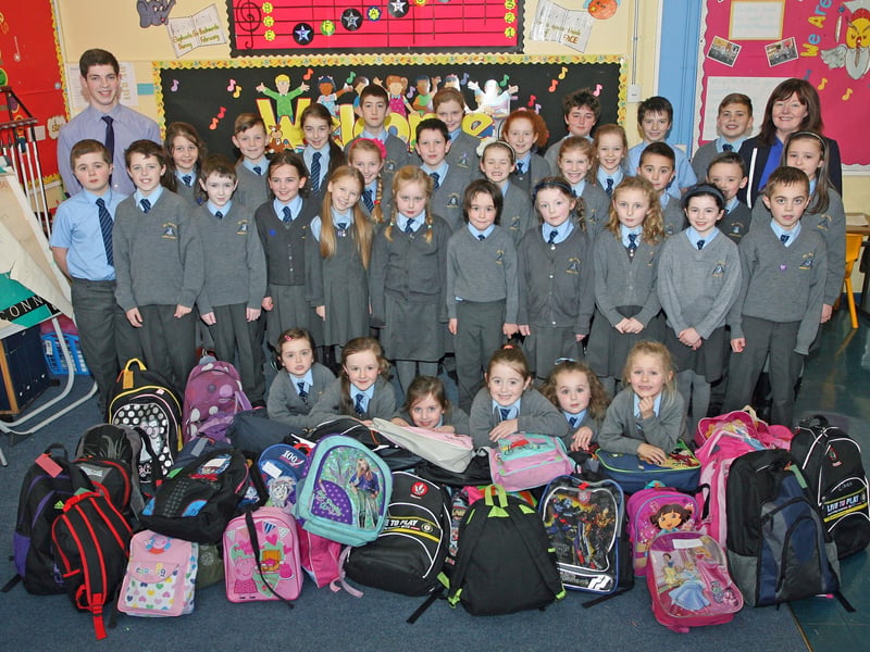 BACKPACKS FOR MALAWI. . . .Pupils from St. Annes' PS, Rosemount, pictured before handing over their 'Backpacks for Malawi' at the school on Thursday afternoon. The proceeds are to help the world's poorest children. Included are Mr. Fergal McNicholl and Mrs. Gillen, teachers. DER4913JM138