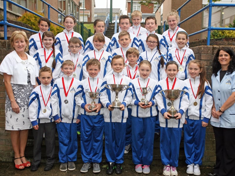 SWIM CHAMPS!. . . St. Anne's PS, Rosemount, who collected a total of seven gold, four silver and a bronze medal in the recent North West Gala held on Thursday, 7th June at William Street Baths. Nineteen primary schools in all competed with St. Anne's PS lifting four of the possible six overall trophies. The group are pictured with, on left, Mrs. Jacinta Bradley, Principal, and right, Ms. Karen O'Brien, coach. 1106JM03