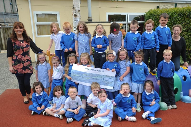 Pupils from Termoncanice Nursery, Limavady who presented a cheque for £100 to the Foyle Hospice, the proceeds of a sponsored vehicle ride. Included, are 
Anne Marie Diamond, teacher, and  Hillary Hargan nursery assistant. (0306SL28)