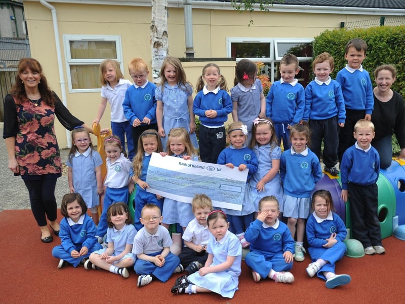 Pupils from Termoncanice Nursery, Limavady who presented a cheque for £100 to the Foyle Hospice, the proceeds of a sponsored vehicle ride. Included, are 
Anne Marie Diamond, teacher, and  Hillary Hargan nursery assistant. (0306SL28)