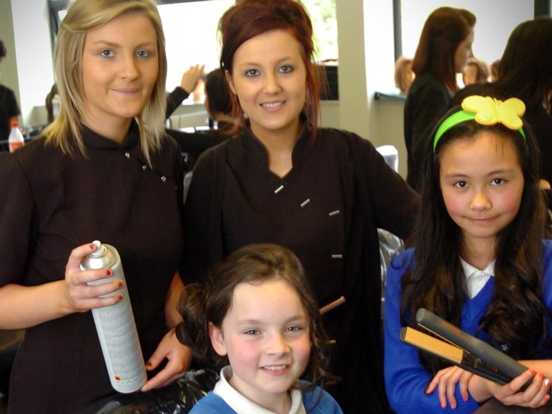 Termoncanice Primary School pupils Mia Doherty, seated, and Sinead Heaney enjoy Tuesday's pamper session with North West Regional College Hair and Beauty Academy students Laura Bradley, left, and Edelle Bradley. (2405PG21)
