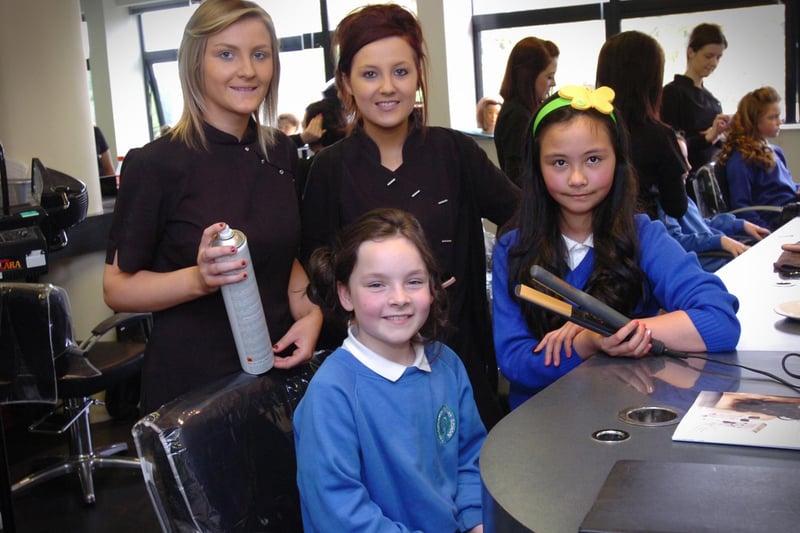 Termoncanice Primary School pupils Mia Doherty, seated, and Sinead Heaney enjoy Tuesday's pamper session with North West Regional College Hair and Beauty Academy students Laura Bradley, left, and Edelle Bradley. (2405PG22)
