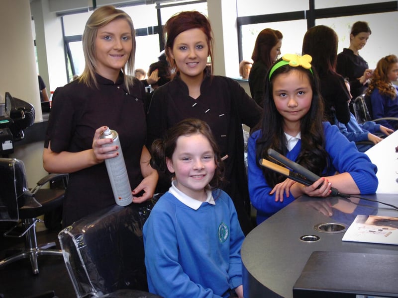 Termoncanice Primary School pupils Mia Doherty, seated, and Sinead Heaney enjoy Tuesday's pamper session with North West Regional College Hair and Beauty Academy students Laura Bradley, left, and Edelle Bradley. (2405PG22)