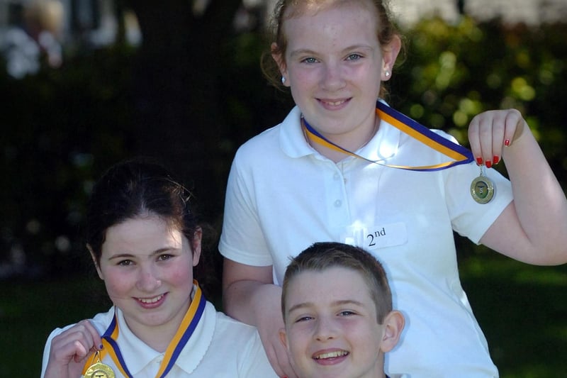 Emma Irwin, left, Charmaine Madden and Eoghan Gormley display the medals they won at the Termoncanice Primary School sports day held on Wednesday. (3105PG70)