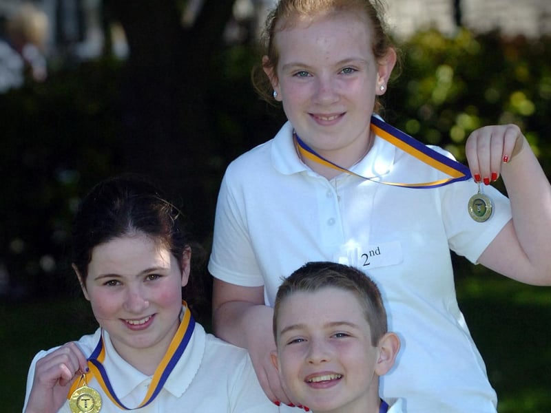 Emma Irwin, left, Charmaine Madden and Eoghan Gormley display the medals they won at the Termoncanice Primary School sports day held on Wednesday. (3105PG70)