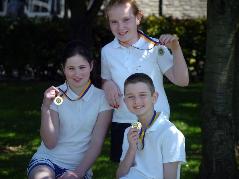 Emma Irwin, left, Charmaine Madden and Eoghan Gormley display the medals they won at the Termoncanice Primary School sports day held on Wednesday. (3105PG71)
