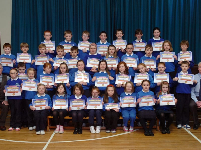 Key Stage 2 pupils from Termoncanice Primary School who received certificates for full attendance, pictured with principal Seamus Coyle, left, and vice principal Leo McCloskey. (1501PG13)