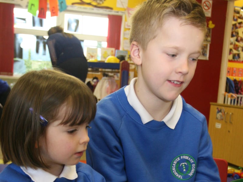 Termoncanice PS P6 pupil Patrick McGlynn pictured with nursery pupil Faith, yesterday morning. 2802JM12