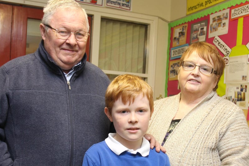 Grandparents Edward and Jane Ann McLaughlin pictured with their grandson Eunan (05) at Termoncanice PS Grandparents To School Day on Wednesday. 0402JM25