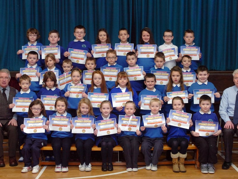 Key Stage 1 pupils from Termoncanice Primary School who received certificates for full attendance, pictured with principal Seamus Coyle, left, and vice principal Leo McCloskey. (1501PG14)