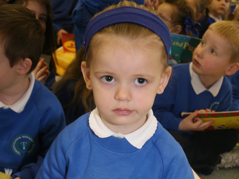 BOOK BUDDY. . . .Nursery pupil Carly Mullan gets into the reading spirit at yesterday's 'Book Buddies' event in Termoncanice PS. 2802JM19