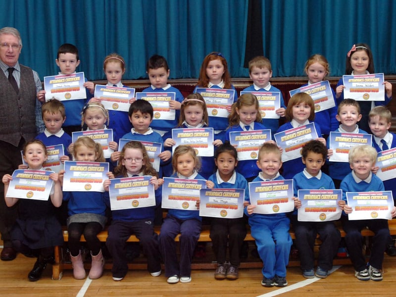 P1 and P2 pupils receive their certificates for full attendance at Termoncanice Primary School. Included is school principal Seamus Coyle. (1501PG15)