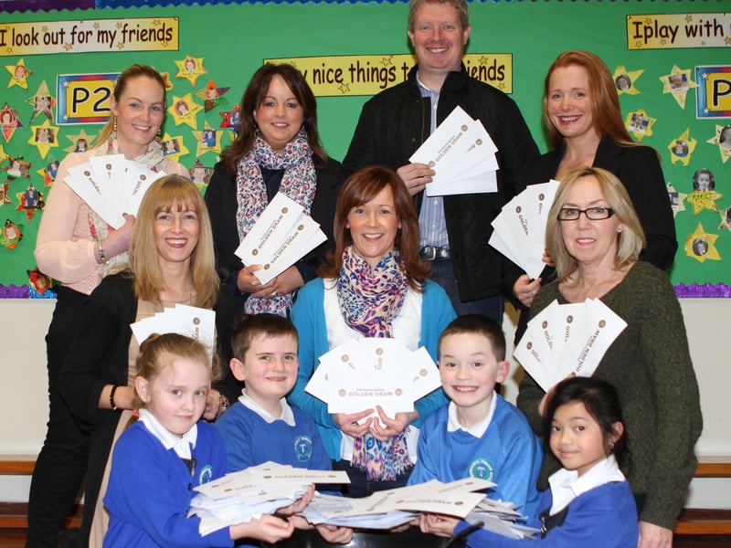 Termoncanice PS pupils Tiana O'Kane, MichaelMcCloskey, Jack McNeill andHannahPetingo with parents committee members Grainne Bradley (Teacher), Collette Poland, Myra McKeown, Angela MacFlynn, Francis McAuley, Paula Morgan and Lynne Kelly-Carton when they made the fundraising draw.(1903jB15)