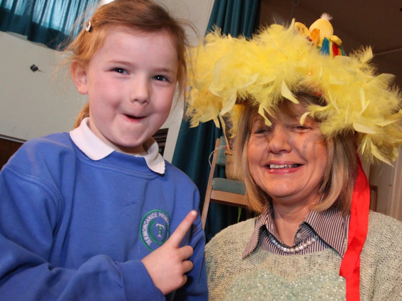 OH, SHE TOOK MY BONNET!. . . .Termoncanice PS pupil Emer McFlynn remonstrates with school principal, Mrs. Harmon over who looks best in the Easter bonnet, at the Limavady school on Wednesday morning. 2803JM90