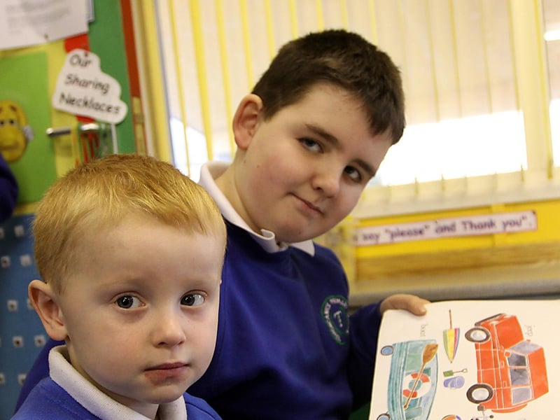 Oisin from the nursery unit at Termoncanice Primary school working with P6 pupil Jason McElhinney in a Book Buddies initiative. INLV0913-046KDR
