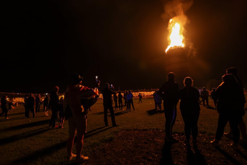 Crowds look on as Craigyhill bonfire in Larne burns. Picture: Philip Magowan / PressEye