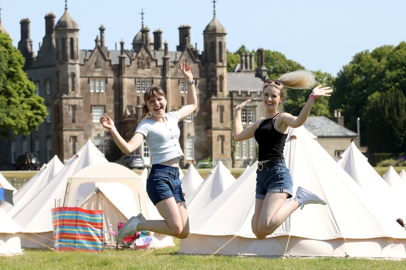 Rebecca Deans ,and Shauna McVeigh both aged 20, from Coleraine, celebrate the start of Dalfest at  Glenarm Castle. Picture: Paul Faith