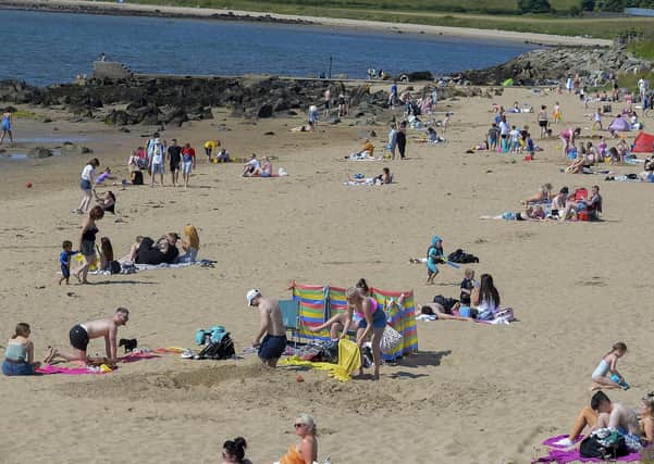 Lady’s Bay on Buncrana’s Shore Front, on Saturday afternoon last. People from Derry flocked to Inishowen’s beaches to enjoy the fine weather. Photo: George Sweeney. DER2128GS – 045