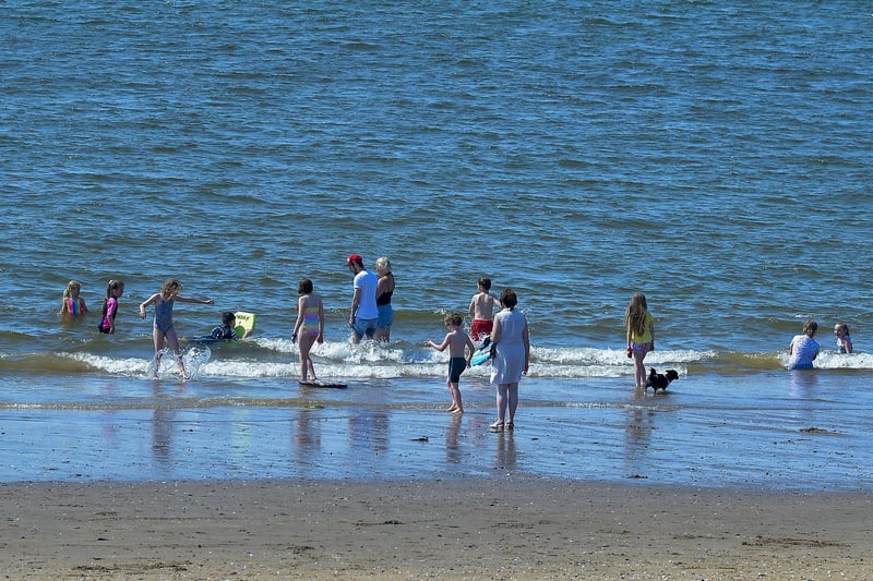 Bathers enjoy the sunshine and the soaring temperatures, at Lady’s Bay on Buncrana’s Shore Front, on Saturday afternoon last. Photo: George Sweeney. DER2128GS – 044