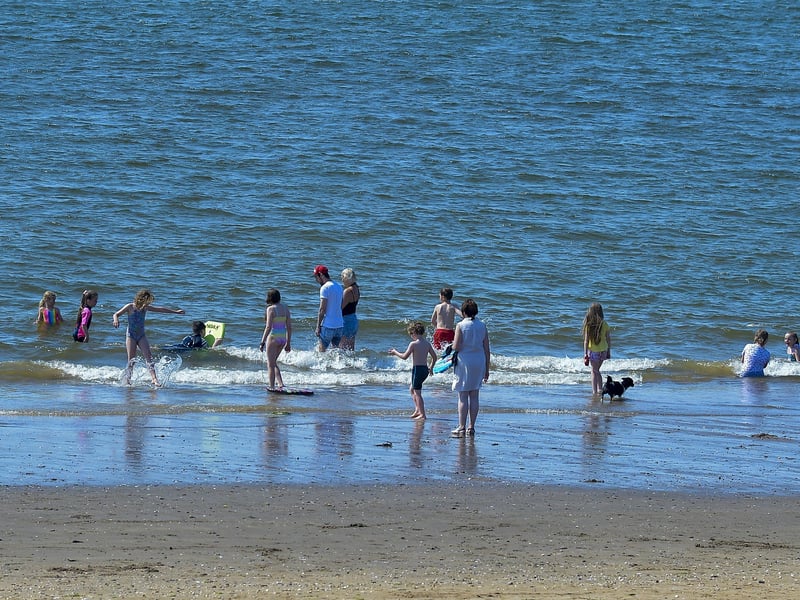 Bathers enjoy the sunshine and the soaring temperatures, at Lady’s Bay on Buncrana’s Shore Front, on Saturday afternoon last. Photo: George Sweeney. DER2128GS – 044