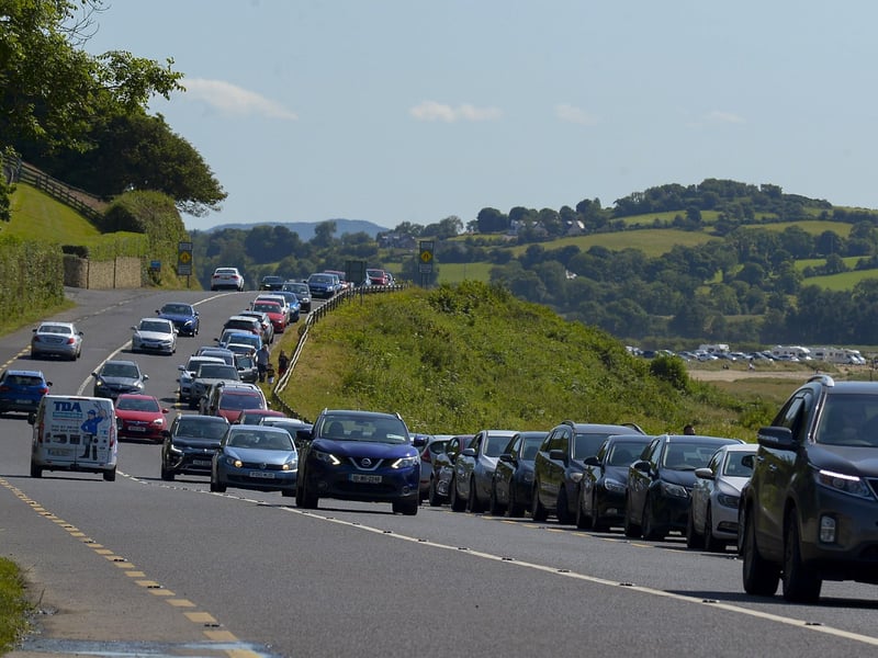 Cars parked along the main road at Lisfannon beach, on Saturday afternoon last, as Derry people flocked to beaches in Inishowen during the mini – heatwave. Photo: George Sweeney. DER2128GS – 046