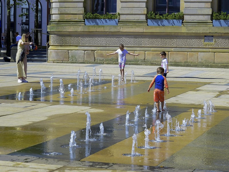 The water fountains in Guildhall Square were popular with children during the warm and sunny weather over the weekend. Photo: George Sweeney. DER2128GS – 052