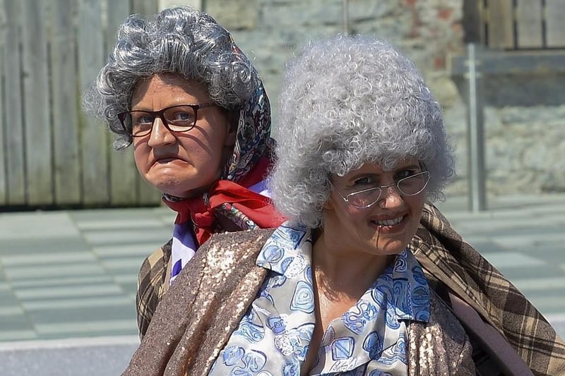 Granny Myrtle and Granny Mavis, from Make â€“ Believe, entertain passers-by, in Ebrington Square, during last weekendâ€TMs mini - heatwave. Photo: George Sweeney. DER2128GS â€“ 053