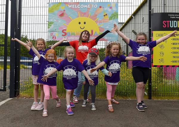 Volunteer Cara pictured with children attending the Greater Shantallow Arts ‘Trolls’ themed Summer Scheme at Studio 2 recently. DER2128GS - 023