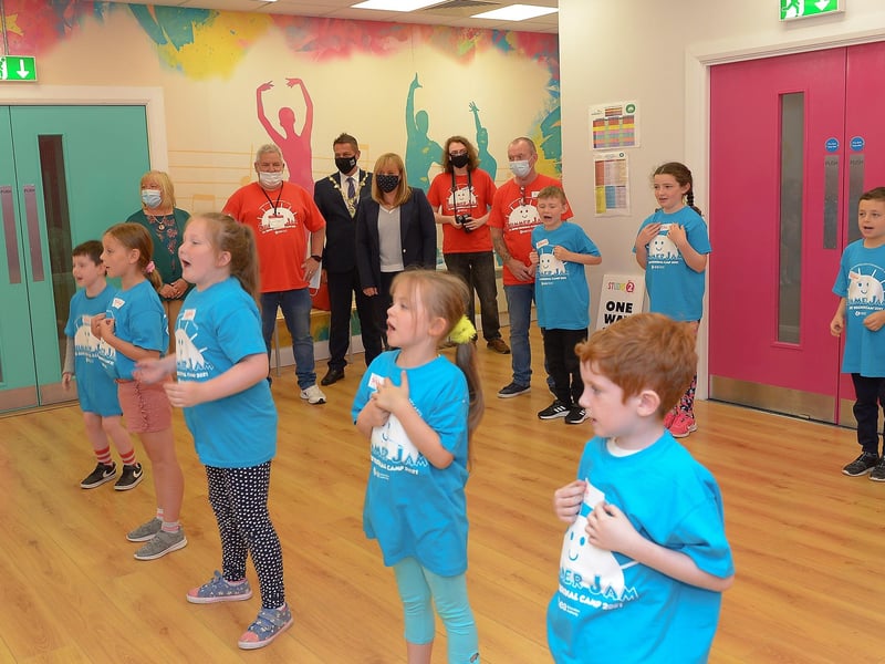 Education Minister Michelle McIlveen MLA pictured with children at Studio 2’s Charlie and The Chocolate Factory theme summer scheme on Wednesday afternoon. Included in the photograph are GSACA board members Bobby Kelly and Catrina McFeeley, Ollie Green GSACA Artistic Director and Mayor Alderman Graham Warke. DER2130GS - 017