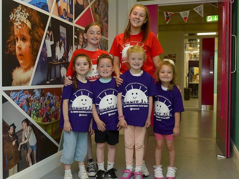 Volunteers Molly and Chloe pictured with Sienna, Cathal, Isla and Maise who attended the Greater Shantallow Arts ‘Trolls’ themed Summer Scheme at Studio 2 recently. DER2128GS - 024
