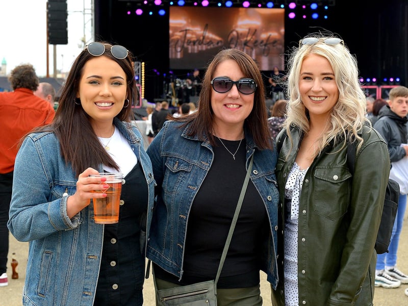 Dungiven girls Michaela, Brenda and Camille pictured at the Boyzlife concert in Ebrington Square on Sunday evening last. Photos: George Sweeney / Derry Journal. DER2131GS – 025