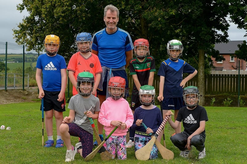 Gerry Matthews, Na Magha, pictured with some of the children who took part in the recent sports camp at Broadbridge Primary School. DER2130GS - 049 (Picture by George Sweeney)