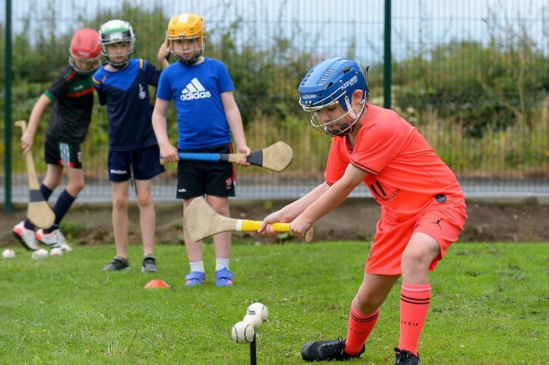Budding hurlers get in some practice at the recent sports camp at Broadbridge Primary School. DER2130GS - 050 (Picture by George Sweeney)