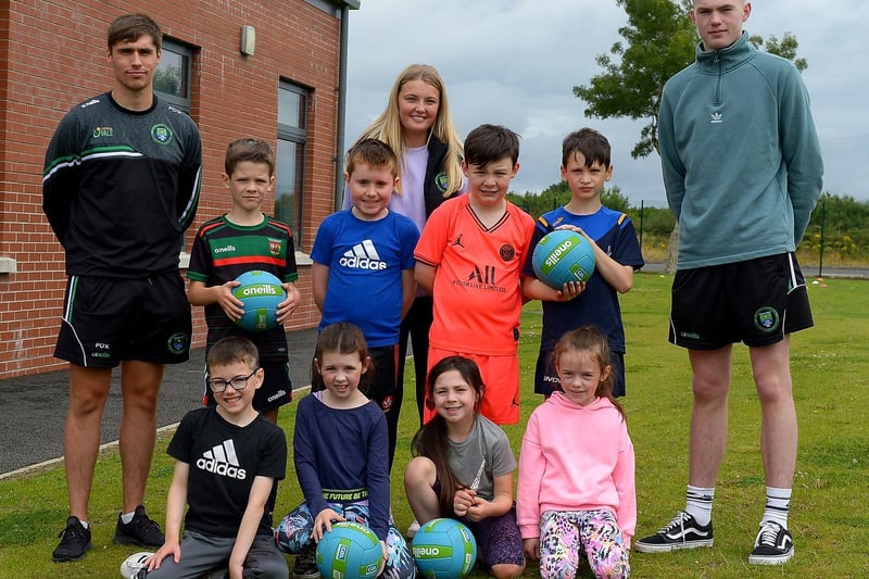 Boys and girls who took part in the recent sports camp at Broadbridge Primary School pictured with St Mary’s Faughanvale’s Paddy O’Kane, Caitlin Lynch and Padhraig O’Neill. DER2130GS - 063 (Picture by George Sweeney)