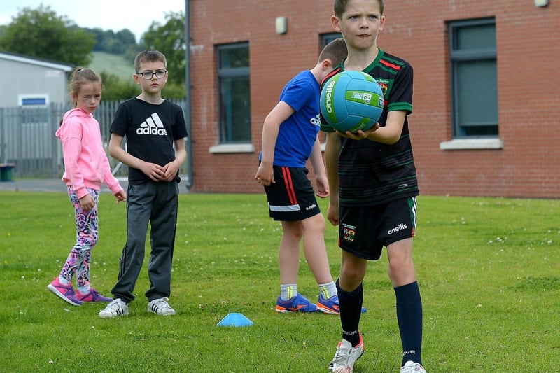 Learning new Gaelic football skills at the recent children’s sports camp at Broadbridge Primary School. DER2130GS - 064 (Picture by George Sweeney)