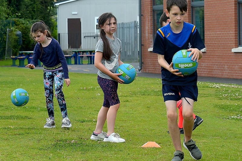 Practicing Gaelic football skills at the recent children’s sports camp at Broadbridge Primary School. DER2130GS - 065 (Picture by George Sweeney)
