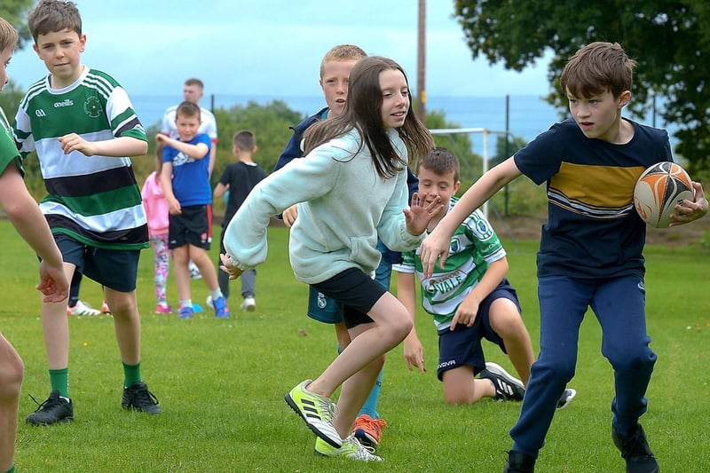 Boys and girls practice their rugby skills at the recent sports camp at Broadbridge Primary School. DER2130GS - 061 (Picture by George Sweeney)